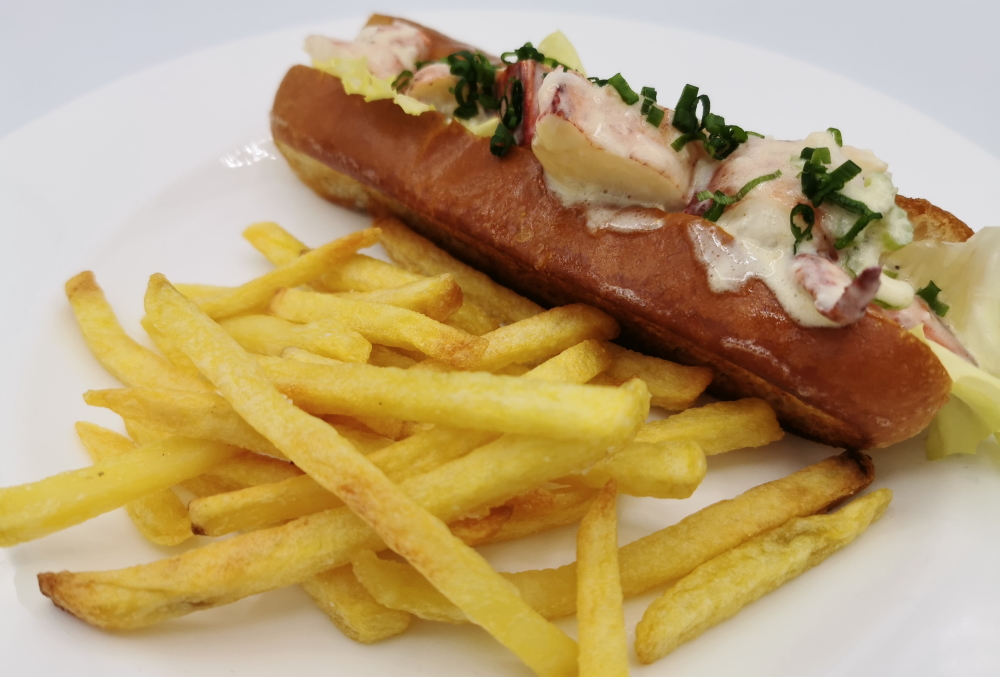 Lobster-roll-with-fries-on-a-plate